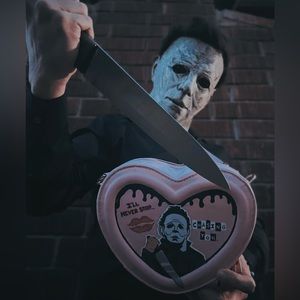 Pink heart-shaped purse hand painted with Michael Myers. Horror art.